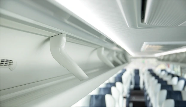 Luggage rack inside a 12m Higer coach bus, showcasing the spacious overhead storage compartment and passenger seating area.