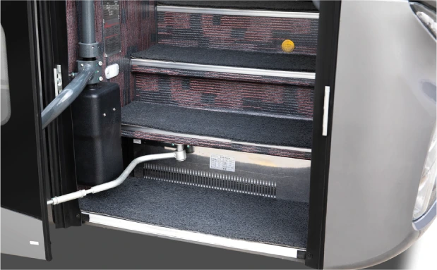 Enlarged front door step of a 12m Higer coach bus, providing easier and safer passenger access.